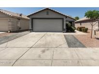 Charming single-story home featuring a two-car garage and well-maintained landscaping at 4232 N 112Th Ln, Phoenix, AZ 85037