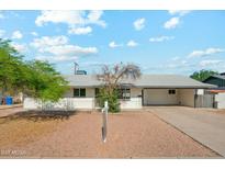 Charming single-story home with well-maintained front yard and covered carport at 843 N Evergreen St, Chandler, AZ 85225
