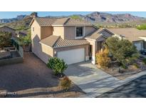 Two-story home featuring a tiled roof, two car garage, desert landscaping, and mountain views at 9548 E Kiva Ln, Gold Canyon, AZ 85118