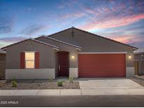 Charming single-story home with a well-manicured front yard and inviting curb appeal at 37341 W San Clemente St, Maricopa, AZ 85138