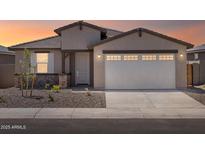 Charming single-story home with a two-car garage, desert landscaping, and a covered front porch at 37373 W San Clemente St, Maricopa, AZ 85138