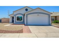 Charming single-Gathering home featuring a two-car garage, low maintenance front yard and neutral color palette at 11501 W Charter Oak Rd, El Mirage, AZ 85335