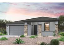 Charming single-story home featuring a two-car garage and desert landscaping for relaxed curb appeal at 17253 W Daley Ln, Surprise, AZ 85387