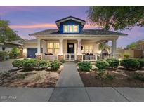 Charming single-Gathering home featuring a welcoming front porch, landscaped yard, and an inviting entrance at 20627 W Grandview Dr, Buckeye, AZ 85396