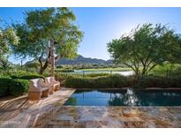 Stunning pool with scenic views of the golf course and desert mountains, perfect for relaxing in a tranquil setting at 27050 N 103Rd St, Scottsdale, AZ 85262