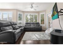 Comfortable living room with a large gray sofa set, TV, and plush chair at 420 W First St # 217, Tempe, AZ 85281