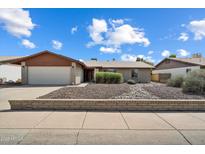 Charming single-story home featuring a two-car garage, manicured landscaping, and a welcoming facade at 5337 W Diana Ave, Glendale, AZ 85302