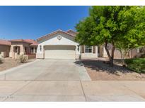 Charming single-story home featuring a well-maintained front yard and a two-car garage at 9518 W Hazelwood St, Phoenix, AZ 85037