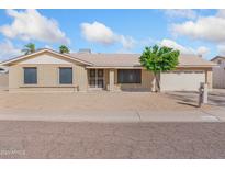 Charming single-story home featuring a low maintenance yard and a two-car garage at 18629 N 10Th Ave, Phoenix, AZ 85027