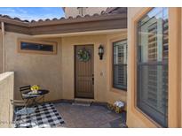 Inviting covered front entry with decorative wreath on the front door at 2145 N 88Th St, Mesa, AZ 85207