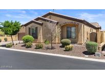 Charming single-story home featuring manicured landscaping, a neutral color palette, and inviting curb appeal at 2145 N 88Th St, Mesa, AZ 85207