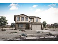 Charming two-story home featuring a two-car garage and a covered front porch in a scenic desert landscape at 17250 W Via Dona Rd, Surprise, AZ 85387