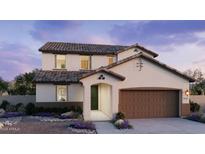 Charming two-story home with a two car garage and nicely landscaped front yard at 25348 W Bowker St, Buckeye, AZ 85326