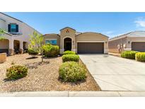 Charming single-story home with desert landscaping and a two-car garage in a residential neighborhood at 28259 N Chalcocite St, San Tan Valley, AZ 85143