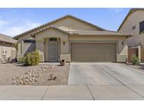 Charming single-story home featuring a two-car garage, desert landscaping, and neutral color palette at 44284 W Buckhorn Trl, Maricopa, AZ 85138