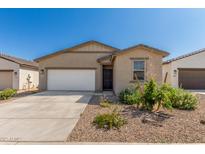 Charming single-story home featuring low-maintenance landscaping, a two-car garage, and a welcoming front entrance at 47859 W Moeller Rd, Maricopa, AZ 85139