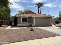 Charming single-story home with a well-maintained front yard and a two-car garage at 7415 S 16Th S Dr, Phoenix, AZ 85041