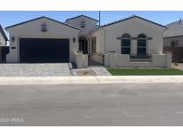 Charming single Gathering home with a private gated courtyard, an attached garage, and manicured landscaping at 1185 E Gleneagle Dr, Chandler, AZ 85249