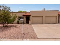 Charming single-story home with a two-car garage and well-maintained landscaping at 4501 E Carol Ave # 48, Mesa, AZ 85206