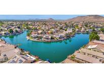 Gorgeous aerial shot of waterfront community with lake views and manicured landscaping at 5252 W Pontiac Dr, Glendale, AZ 85308