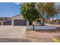 Charming home featuring a well-maintained front yard and a spacious two-car garage, perfect for suburban living at 2701 E Caldwell St, Phoenix, AZ 85042