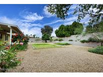 Backyard featuring gravel landscaping, garden and plantings at 4522 E Andora Dr, Phoenix, AZ 85032