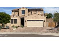 Beautiful two-story home featuring a well-maintained front yard and a spacious two car garage at 12950 W Cassia Trl, Peoria, AZ 85383