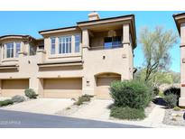 Inviting townhouse with a private garage and desert landscaping at 16420 N Thompson Peak Pkwy # 2020, Scottsdale, AZ 85260