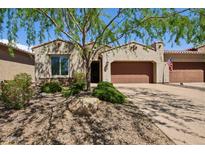 Charming home featuring a desert landscaped yard, covered entry, and two-car garage at 16946 W Vernon Ave, Goodyear, AZ 85395