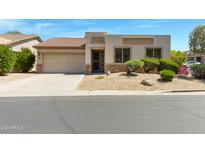 Charming single-Gathering home featuring a desert-landscaped front yard and an attached two-car garage at 3531 N Sericin --, Mesa, AZ 85215