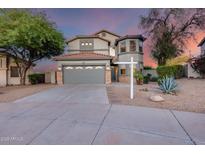 Charming two-story home with a well-manicured yard and a two-car garage is perfect for any Gathering at 18103 W Canyon Ln, Goodyear, AZ 85338