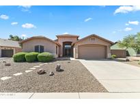 Charming single-story home featuring a well-manicured front yard and inviting entrance at 2453 E Nathan Way, Chandler, AZ 85225