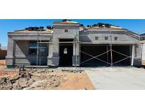 Unfinished home exterior shows stucco facade and partial roof tiles, pre-landscaping at 5064 E Midnight Star Dr, San Tan Valley, AZ 85143