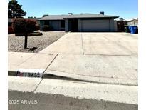 Charming single-story home featuring a neutral color scheme, landscaped yard, and a spacious two-car garage at 10852 N 39Th Ave, Phoenix, AZ 85029
