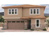 Two-story home with a two-car garage and decorative stone accents enhancing the facade at 16986 W Winston Dr, Goodyear, AZ 85338