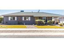 Charming single-story home featuring a well-maintained yard and neutral gray paint at 2715 E Edgemont Ave, Phoenix, AZ 85008