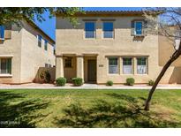Charming two-story home boasts a well-manicured lawn and inviting curb appeal at 3530 S Bandit Rd, Gilbert, AZ 85297