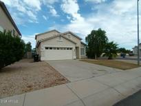 Charming single-Gathering home featuring a two-car garage and low-maintenance landscaping in a residential neighborhood at 14149 N Gil Balcome Ct Ct, Surprise, AZ 85379