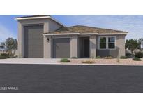 Charming single-story home with a three car garage, neutral color palette and desert landscaping at 15785 W Cheryl Dr, Waddell, AZ 85355