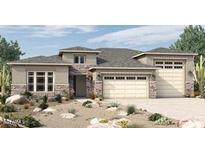 Beautiful single-story home with a stone-accented facade, desert landscaping, and a two-car garage at 19988 W Marshall Ave, Litchfield Park, AZ 85340