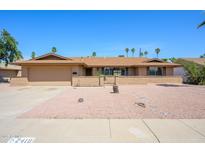 Charming single-story home featuring a well-maintained yard and a two-car garage at 2418 E Huntington Dr, Tempe, AZ 85282