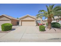 Charming single-story home with a well-maintained front yard, desert landscaping, and a two-car garage at 3612 W Charlotte Dr, Glendale, AZ 85310