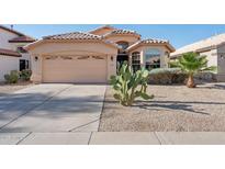 Charming single-Gathering home featuring a two-car garage, neutral stucco, and desert landscaping at 3898 E San Remo Ave, Gilbert, AZ 85234