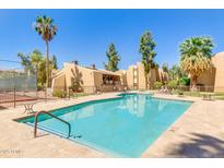 Outdoor pool featuring a blue surface and lounge chairs for relaxing by the water at 8055 E Thomas Rd # B208, Scottsdale, AZ 85251
