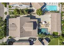Stunning aerial view of a home featuring a backyard with a pool and an outdoor seating area at 1379 S Claiborne Ave, Gilbert, AZ 85296