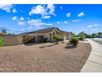 Inviting single story home with a two car garage and desert landscaping for easy maintenance at 14625 W Redfield Rd, Surprise, AZ 85379