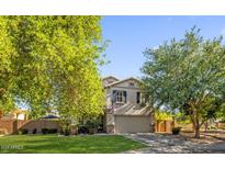 Charming two-story home featuring desert landscaping and a well-maintained front yard at 2545 E Harrison Ct, Gilbert, AZ 85295