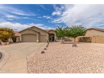 Charming single-story home with a three-car garage, neutral stucco, and desert landscaping for low maintenance at 11010 W Palm Ln, Avondale, AZ 85392