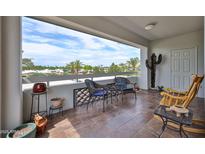 Cozy balcony with tile floor, outdoor seating and great views of the community at 17404 N 99Th Ave # 318, Sun City, AZ 85373