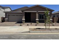 Charming single-story home featuring a well-manicured front yard and a neutral-colored exterior at 21838 E Bonanza Ct, Queen Creek, AZ 85142